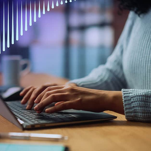 Hands typing on a keyboard
